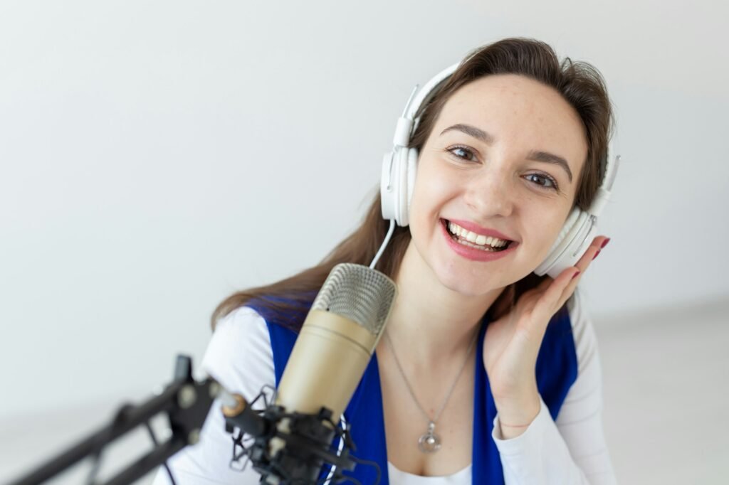 Radio host concept - Portrait of woman radio presenter with headphones